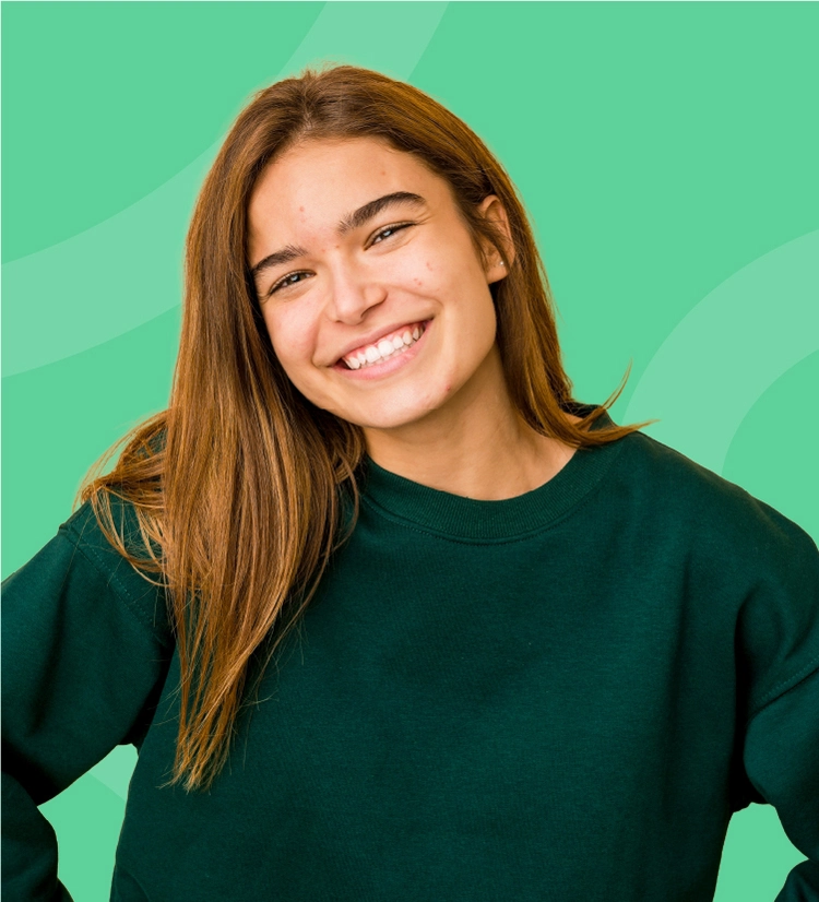 Teenage girl with acne smiling to camera
