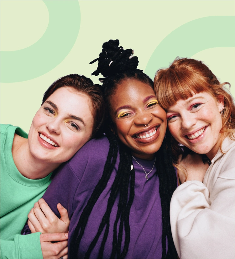 Three teenage girls with acne smiling to camera