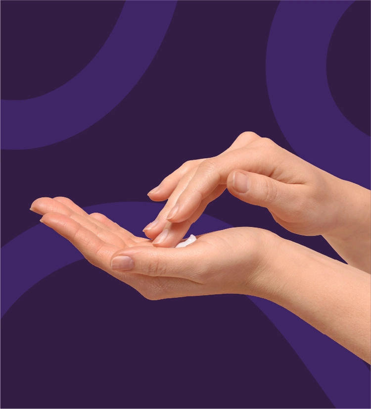 A hand holds a small amount of TWYNEO cream while the other hand dabs it to apply to the face