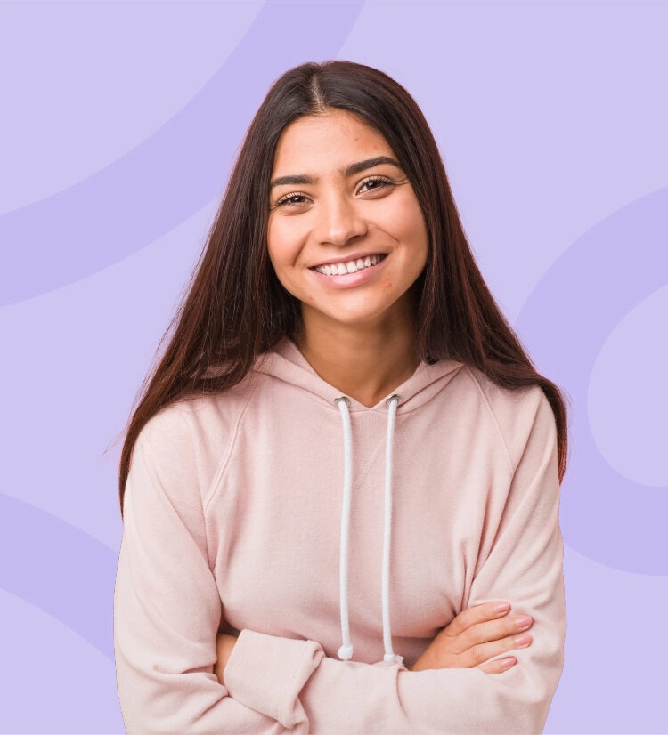 Teenage girl with acne smiling to camera